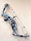 Hoyt compound bow with H-6-BR cam and a half cams, Trophy Ridge sights and quiver, and Trophy Taker
