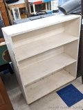 Nice wooden shelving unit is sturdy and measures 34