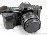 Olympus ON77AF film camera with manual. Camera in nice condition and about 6-1/2