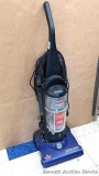 Bissel Powerforce Helix vacuum cleaner picks up debris and hose has suction. Stands 45