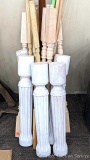 Various spindles, wooden dowels, stairway handle, possibly more. Chunky white wooden pedestals are