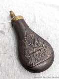 Italian muzzleloader black powder flask has a copper body and brass fittings. Plunger nozzle works.