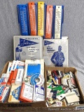 Vintage thermometers, first aid supplies, matches, matchbooks, Fabrico waders and rain jacket.