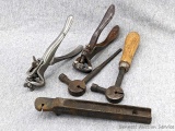 Two man saw tooth setting tools incl. hammer style, and squeeze style, one has an adjustable set