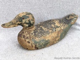 Antique wooden duck decoy looks like it was once a Mallard. Glass eyes intact. Measures 16