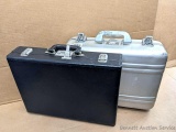 Two hard handgun cases with combination locks. Both in good condition and each about 18