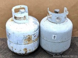 No shipping. Two empty or nearly empty 20 lb propane tanks have newer style OPD valve.