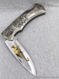 Red Dragon Folding Knife in a pocket knife style but unless you are Andre the Giant it won't fit in