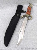 Unique serpent design fixed blade knife with sheath. Measures 15