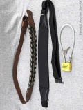 2 firearm gun slings and a gun lock device with keys. Braided sling measures approx 38