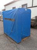 Shappell Minute Man ice fishing shanty has to fishing cutouts with lids in the bottom. In good