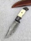 Titan fixed blade knife with sheath measures 9-1/8