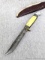 Western fixed blade knife is marked Boulder, Colo patented Made in USA measures 9-3/8