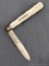 Antique fruit knife with a sterling silver blade, mother of pearl handle slabs, nice tooling on
