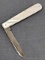 Antique fruit knife with a stainless steel blade, and mother of pearl handle slabs. The knife was