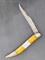 Ka-Bar Texas toothpick style folding pocket knife with a stainless steel blade. The Ka bar knife is