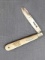 Vintage sterling silver folding pocket knife with mother of pearl handle slabs. The knife is in very