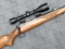 Savage model 110 bolt action rifle in the iconic .300 Savage is topped with a Simmons Aetec