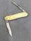 Vintage Remington UMC folding pocket knife with gold plated handles and dual blades. The knife is in