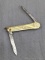 Vintage Ladies folding pocket knife with gold plated engraved handles. The knife is in pretty good