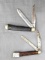 Pair of Queen Cutlery Co. folding pocket knives each with two blades. Both are in pretty good