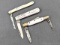 Three vintage folding pocket knives with ivory colored bone or similar handles, mother of pearl, and
