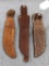 Three leather fixed blade knife sheaths. One for a Rapala fillet knife, about 11-1/2
