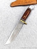 Western brand fixed blade knife with sheath was made in USA and is marked on blade 'W36 C'. Brass
