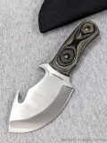 Timber Wolf pack out knife with gut hook is marked TW36. Comes with sheath. In good condition,