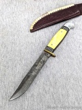 Western fixed blade knife is marked Boulder, Colo patented Made in USA measures 9-3/8