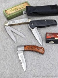 Three folding knives including Cabela's Club knife, Frost Cutlery Flying Falcon 7