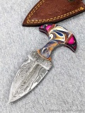 Seller notes this handmade damascus knife is 1095 and 15N20 steel. The knife has a 3 1/4