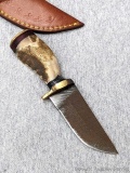 Seller notes this handmade damascus knife is 1095 and 15N20 steel. The knife has a 3 1/4