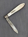 Antique fruit knife with what I believe to be a sterling silver blade but I do not recognize the