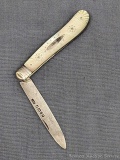 Antique fruit knife with a sterling silver blade, engraved mother of pearl handle slabs, and