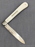 Beautiful antique fruit knife with a sterling silver blade, mother of pearl handle slabs, and