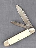 Camillus No. 23 folding pocket knife with ivory toned celluloid or similar handle slabs. The knife