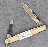 Vintage Remington UMC folding pocket knife with a main blade and a nail file blade. The knife is in