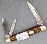 Vintage Remington UMC folding pocket knife with two blades and a nail file. The knife is in overall