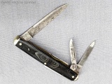 Vintage Remington UMC folding pocket knife with two blades and a nail file. The knife is in overall