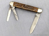 Vintage Remington UMC folding pocket knife with three blades. The knife is in overall good