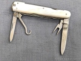 Vintage Andrews Toledo Sheffield folding pocket knife with mother of pearl handles. The knife is in