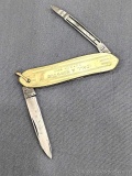 Vintage Remington UMC folding pocket knife with gold plated handles and dual blades. The knife is in