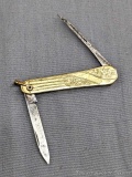 Vintage Ladies folding pocket knife with gold plated engraved handles. The knife is in pretty good