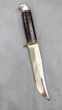 Vintage Western fixed blade knife. The knife is in good condition considering its age with a little