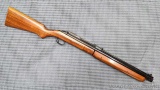 Sheridan model Blue Streak 5mm pellet rifle is overall good with light handling marks. Rifle cocks,