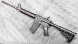 Ruger AR-556 rifle with 30 round Pmag, flip up rear sight, and six position butt stock. The 16