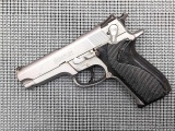 Smith & Wesson Model 5906 stainless steel 9mm pistol with ambidextrous de-cock and Novak sights. The