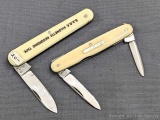Pair of Sheffield England made folding pocket knives with ivory toned celluloid or similar handles.