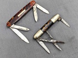 Two vintage folding pocket knives with retro handles. Both of the knives are in pretty good shape,